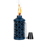 Mainstays textured blue metal table torch lit with a visible flame and black cap placed beside it on white background