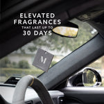 Maison & Muse square air freshener hanging from a car rearview mirror with text about fragrances lasting up to 30 days