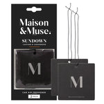 Packaged Maison & Muse Sundown leather & cedarwood square car air freshener with two loose black hanging cards