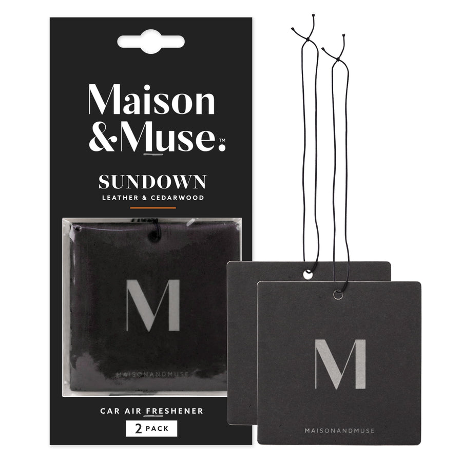 Packaged Maison & Muse Sundown leather & cedarwood square car air freshener with two loose black hanging cards