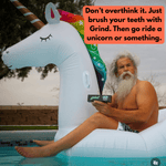 Bearded man sitting on a large inflatable unicorn float by a pool holding a Grind toothpaste box with a playful caption bubble