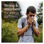 Man outdoors holding a tissue to his nose with text about strength and absorbency for allergy sufferers