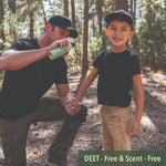 Man spraying a Natrapel Kids can on a young boy's arm in a forest setting with a 'DEET-Free & Scent-Free' banner.