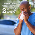 Outdoor-style image of a man using a tissue with text stating 'Trusted Care tissues have 2 strong layers'