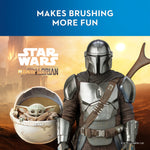 Promotional graphic showing The Mandalorian and Grogu with text 'Makes brushing more fun' on themed background