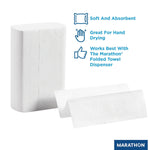 Close-up of a wrapped stack of Marathon multifold towels beside two unfolded towel panels and benefit icons