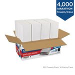 Open shipping carton showing stacks of white folded paper towels standing on top of a Marathon multi-fold towels case