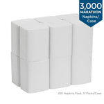 Six wrapped white packs of interfold napkins arranged in two rows with a 3,000 napkins per case badge
