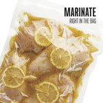 Vacuum-sealed bag containing marinated chicken with lemon slices and headline text reading "MARINATE RIGHT IN THE BAG"