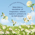 Promotional meadow scene with scattered white flowers and copy inviting you to ‘Step into a meadow of fragrance’
