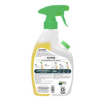 Rear view of a Mean Green refillable bathroom cleaner bottle showing label text, usage instructions and green spray nozzle.