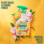 Mean Green refillable bathroom cleaner bottle against a yellow background with tropical flowers and mango graphics.