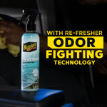 Meguiar's Air Re-Fresher bottle placed on a car seat with bold yellow text 'Odor Fighting Technology' to the right.