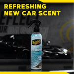 Meguiar's Air Re-Fresher bottle standing upright on a reflective surface with text 'Refreshing New Car Scent' above.