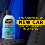 Meguiar's air re-fresher can placed on a car seat with text ‘Rediscover That New Car Feeling in Just 15 Minutes’.