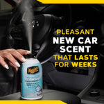 Hand pressing the nozzle of a Meguiar's air re-fresher can inside a car with text ‘Pleasant New Car Scent That Lasts For Weeks’.