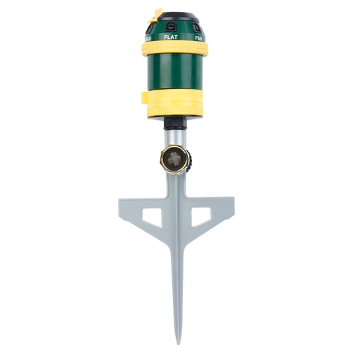 Melnor green and yellow rotary sprinkler mounted on a gray step spike against a white background