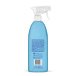 Rear view of a blue Method Bathroom Cleaner spray bottle showing ingredient text and a barcode on white background