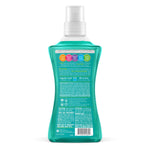 Rear view of a teal Method laundry detergent bottle showing ingredient and usage text and barcode