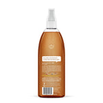 Rear view of a clear amber Method spray bottle showing back label text, barcode and white trigger cap