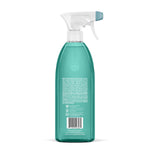 Rear view of a teal Method spray bottle showing ingredient text and barcode on the back label