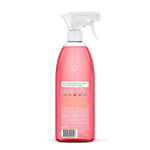 Rear view of a translucent pink Method all-purpose spray bottle showing label text and barcode