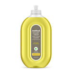 Clear oval bottle of Method Squirt + Mop hard floor cleaner with yellow lemon-ginger liquid and front label