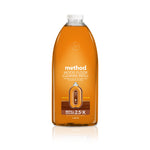 Clear amber Method wood floor cleaner refill bottle labeled almond with front-facing product label on white background