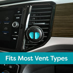 Close-up of a black-and-teal Refresh Your Car mini diffuser clipped to a vehicle air vent with a banner stating Fits Most Vent Types