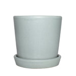 Semi-matte mint ceramic plant pot with matching saucer on white background, front view