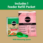 Miracle-Gro product box shown with a pink feeder refill packet and a green measuring spoon against a beige background