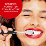 Smiling model brushing with a Colgate Optic White Pro Series toothbrush, product claim text reads designed for better stain removal