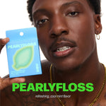 Model holding a blue pearlyfloss mint floss box near face with bold pearlyfloss logo text overlay