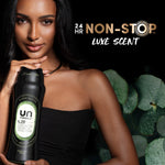 Model holding a black Downy Unstopables N.09 bottle with text '24 HR non-stop luxe scent' on a dark background