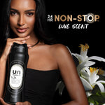 Model holding a black Unstopables N.24 bottle with white flowers and text "24 HR Non-Stop Luxe Scent"