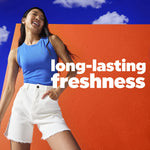 Smiling woman in casual clothes posed against an orange wall with copy reading 'long-lasting freshness' and blue sky