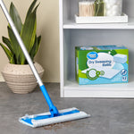 Mop in use on floor with Great Value dry sweeping refills box displayed on a shelf in the background