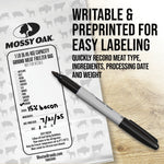 Close-up of a Mossy Oak freezer bag being labeled with a marker and text promoting writable, preprinted labeling.