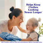Smiling mother and young child leaning over a pile of laundry with copy reading ‘Helps Keep Clothes Looking Newer Longer’