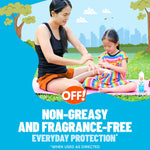 Mother applying repellent to a seated child on a picnic mat with OFF! product and non-greasy claim in the graphic