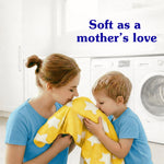 Mother and child smelling a yellow star-patterned blanket in a laundry room with headline ‘Soft as a mother’s love’