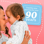 Mother holding toddler close with a pink background panel stating Dreft used by new parents for over 90 years