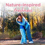 Outdoor scene of a woman hugging a child with trees in the background and 'nature-inspired freshness' text