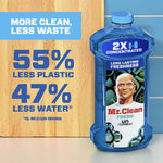 Blue Mr. Clean 2X concentrated bottle beside text highlighting '55% less plastic' and '47% less water' on wood backdrop