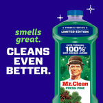 Blue-background promotional image of Mr. Clean Fresh Pine bottle with text saying smells great and cleans even better