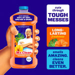 Hand holding a Mr. Clean Hawaiian Aloha bottle against a purple background with callouts about tough messes and freshness