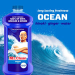 Blue Mr. Clean Ocean bottle pictured against a stylized ocean wave background with ocean scent notes text
