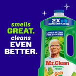 Partial view of a green Mr. Clean bottle with text reading "smells great. cleans even better." on a dark blue background.