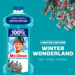 Close-up of Mr. Clean Winter Wonderland bottle beside frosted pine branches, limited edition label and winter scent text