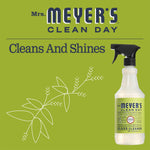 Mrs. Meyer's Clean Day branded green graphic reading 'Cleans And Shines' with a bottle image and botanical illustration